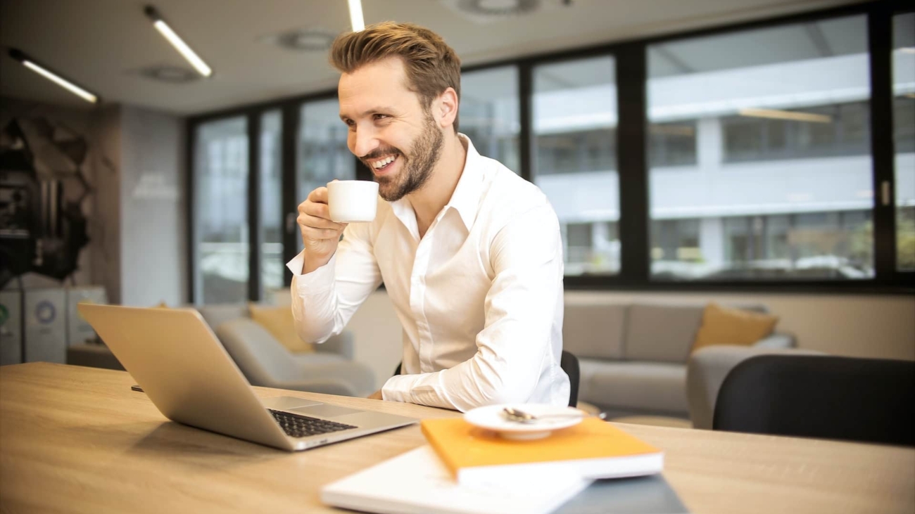 Recruitment company - Happy Person looking at laptop