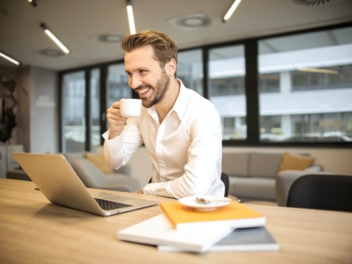Recruitment company - Happy Person looking at laptop